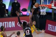 Malcolm Brogdon #7 of the Indiana Pacers has his shot blocked by Bam Adebayo #13 of the Miami Heat.